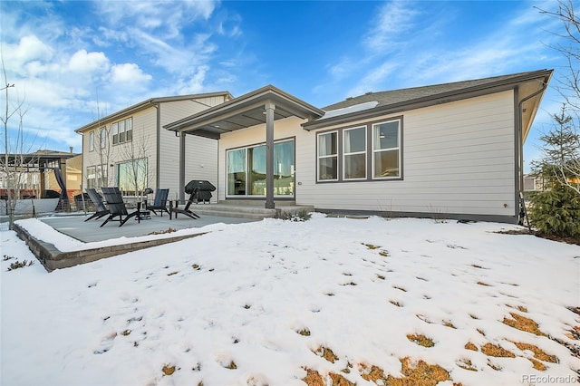 view of snow covered house