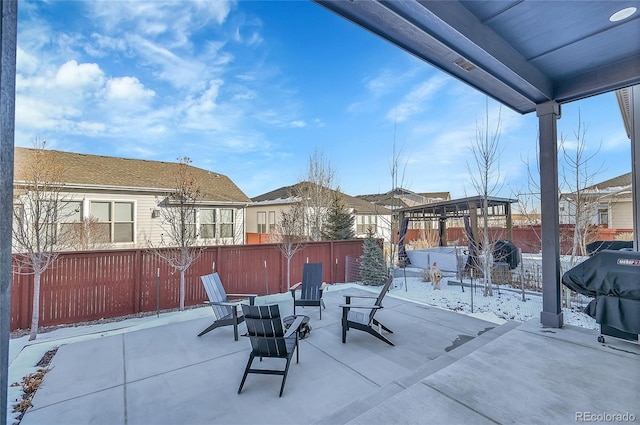 snow covered patio with grilling area