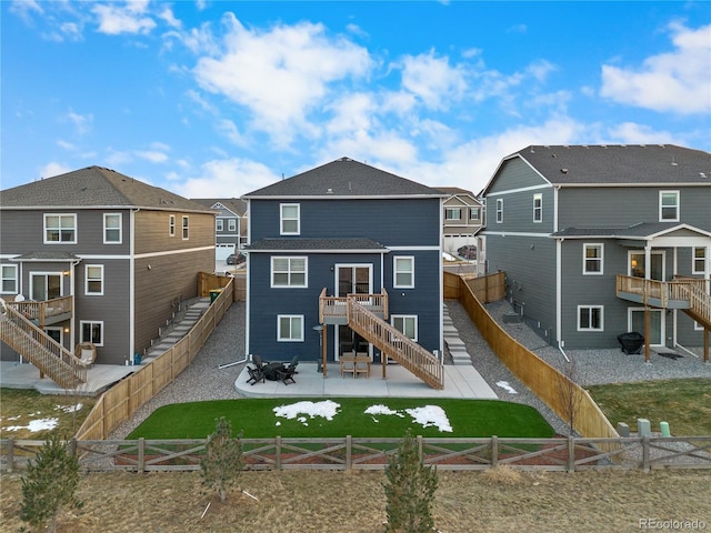 back of property with a wooden deck