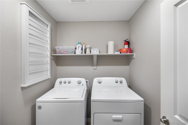 laundry room with washer and dryer