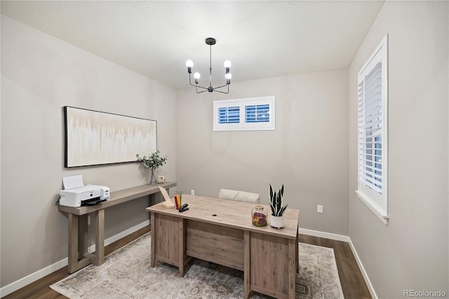 office featuring a chandelier and hardwood / wood-style flooring