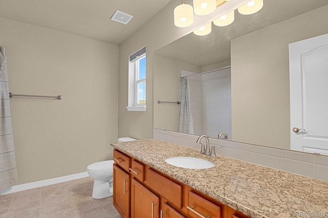 bathroom with a shower with curtain, tile patterned flooring, vanity, and toilet