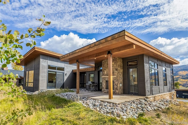 rear view of house with a patio area