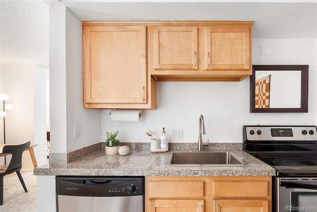 kitchen with light brown cabinets, tile countertops, appliances with stainless steel finishes, and a sink