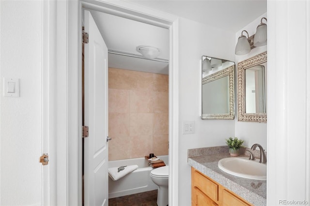 bathroom with vanity, toilet, and washtub / shower combination