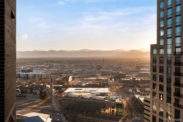 property's view of city with a mountain view