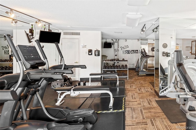 exercise room featuring visible vents