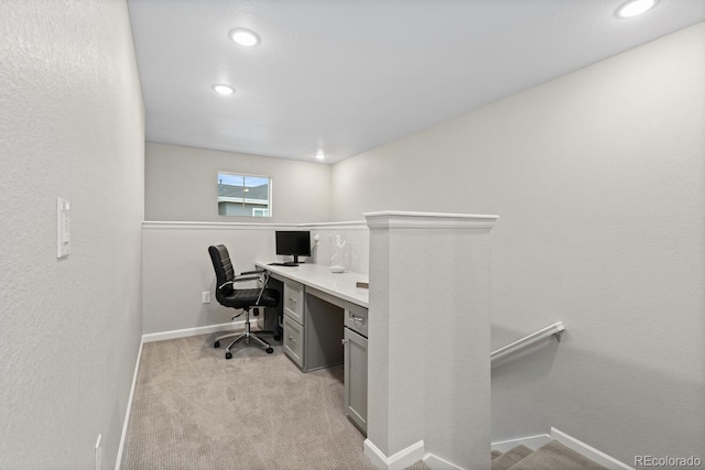 office space featuring baseboards, recessed lighting, and light carpet