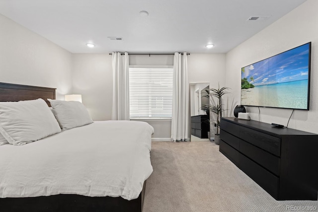 bedroom featuring light colored carpet, recessed lighting, and baseboards