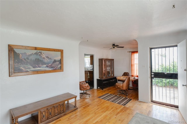2665 W College Ave, Denver, CO 80219 - entrance foyer with wood finished floors, arched walkways, and ceiling fan