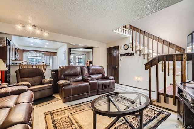 2072 S Helena St Unit B, Aurora, CO 80013 - living area featuring a textured ceiling and stairs