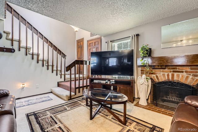 2072 S Helena St Unit B, Aurora, CO 80013 - living room featuring stairway, a textured ceiling, and a brick fireplace
