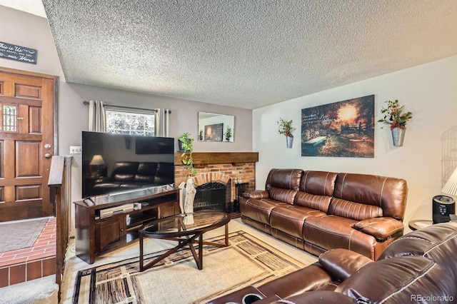 2072 S Helena St Unit B, Aurora, CO 80013 - living room with a textured ceiling and a brick fireplace
