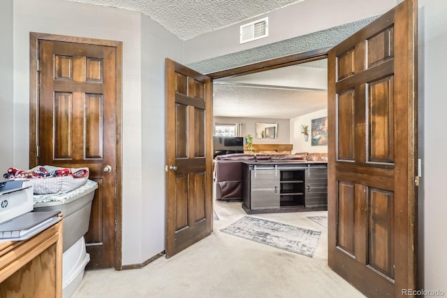2072 S Helena St Unit B, Aurora, CO 80013 - bar area with a textured ceiling and light carpet