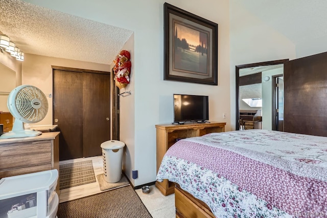 2072 S Helena St Unit B, Aurora, CO 80013 - bedroom with a closet and a textured ceiling