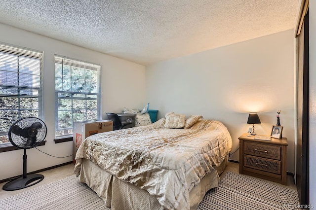 2072 S Helena St Unit B, Aurora, CO 80013 - bedroom with light colored carpet and a textured ceiling