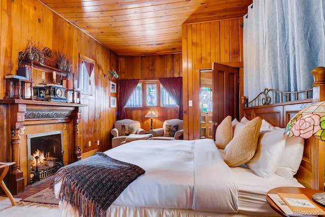 bedroom with wooden walls, wood ceiling, and a fireplace