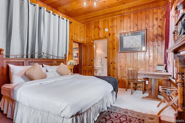 carpeted bedroom featuring wood ceiling and wood walls