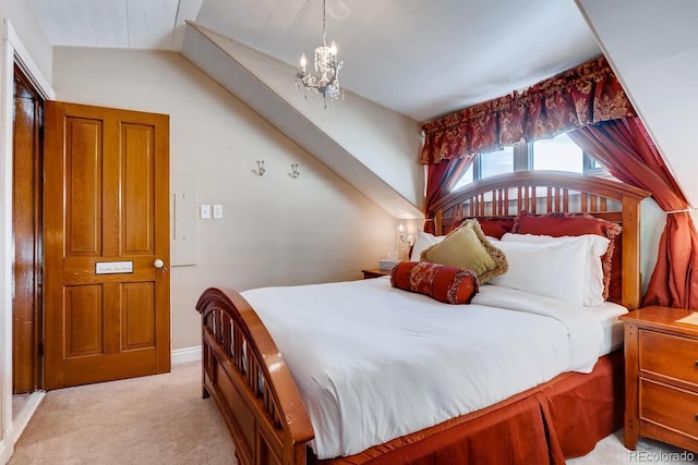 bedroom with a chandelier and light carpet