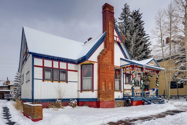 view of front of house featuring a chimney