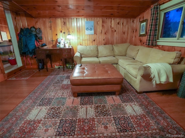 living room featuring wood walls, wood finished floors, and wood ceiling