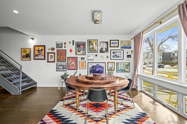 dining area featuring dark wood-type flooring