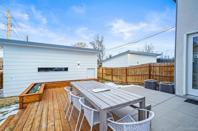 wooden deck featuring central AC and a patio area