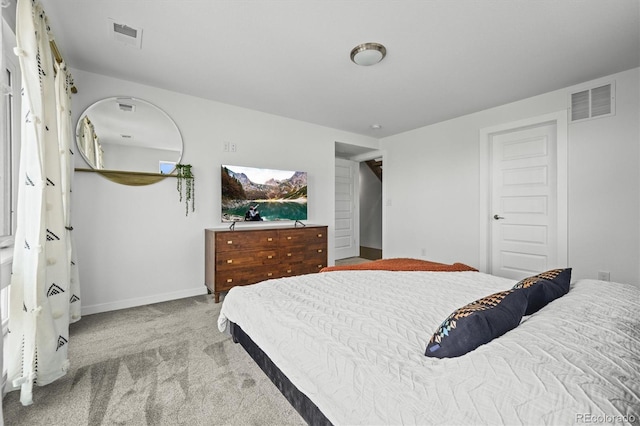 bedroom featuring light carpet