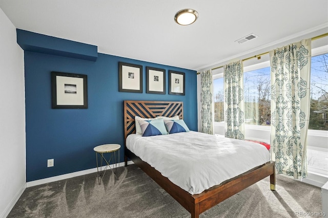 bedroom featuring dark colored carpet