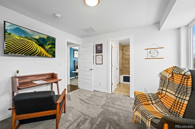 living area with light colored carpet