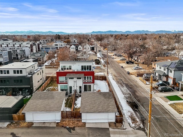 birds eye view of property with a mountain view