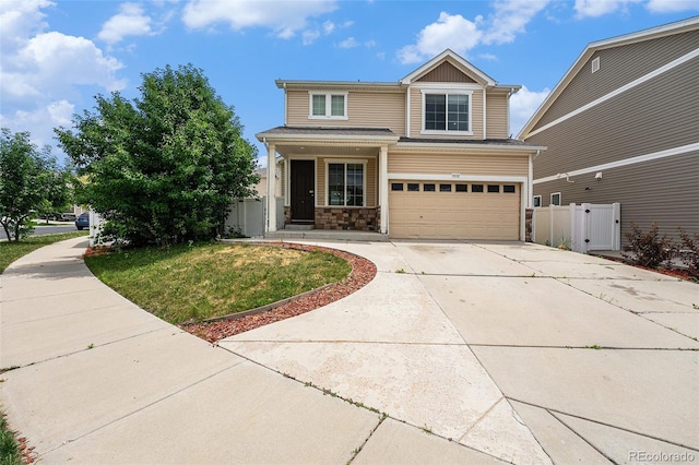 5572 Killarney St, Denver, CO 80249 - traditional-style home featuring driveway, a garage, and stone siding