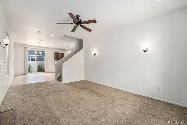 5572 Killarney St, Denver, CO 80249 - unfurnished living room featuring stairway, light colored carpet, a chandelier, a ceiling fan, and recessed lighting