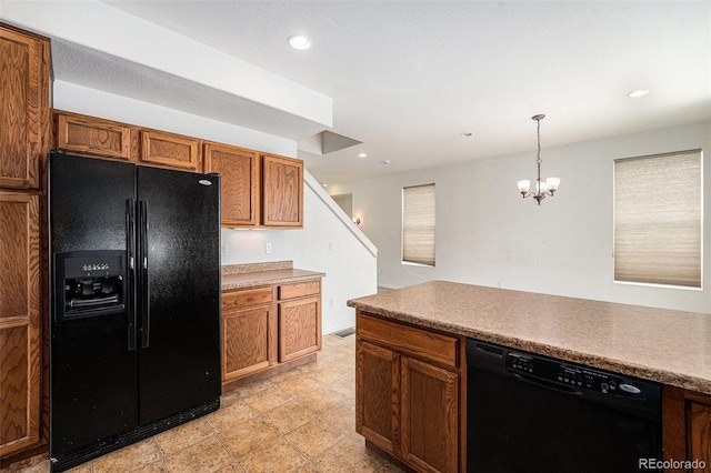 5572 Killarney St, Denver, CO 80249 - kitchen with black appliances, hanging light fixtures, a chandelier, brown cabinetry, and recessed lighting
