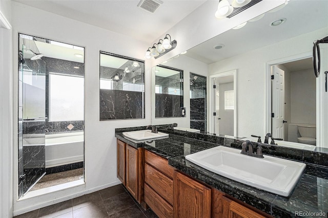 5572 Killarney St, Denver, CO 80249 - bathroom with double vanity, a bath, tiled shower, and tile patterned flooring