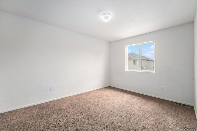 5572 Killarney St, Denver, CO 80249 - spare room with carpet flooring and baseboards