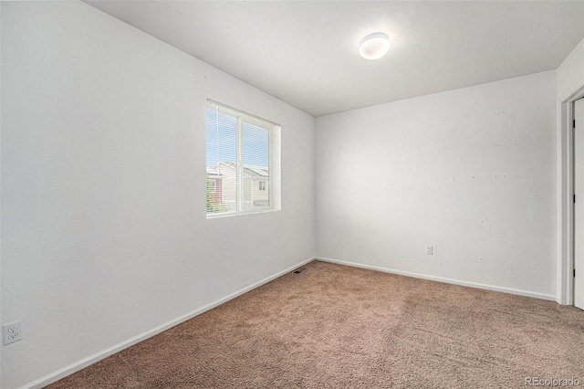 5572 Killarney St, Denver, CO 80249 - spare room featuring light colored carpet and baseboards