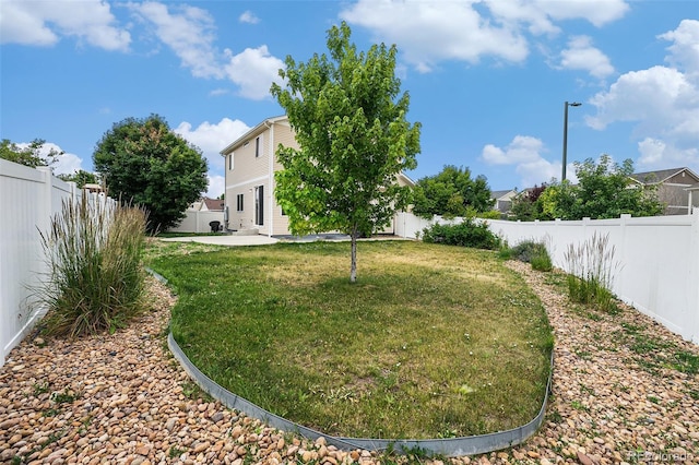 5572 Killarney St, Denver, CO 80249 - fenced backyard featuring a patio