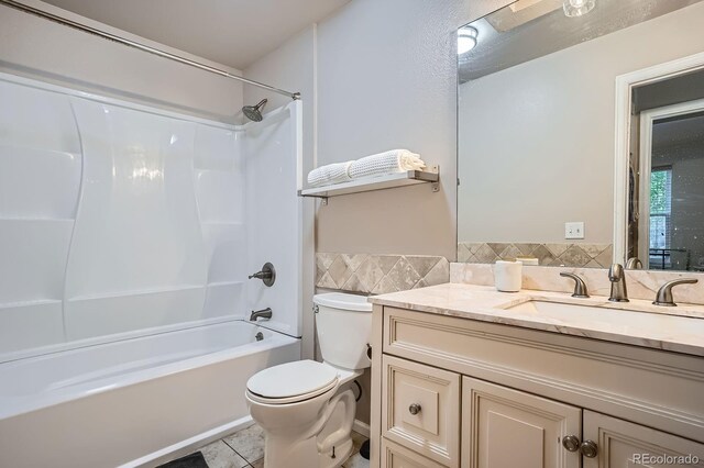 8168 Washington St Unit 46, Denver, CO 80229 - bathroom featuring toilet, shower / bathtub combination, tile patterned floors, and vanity
