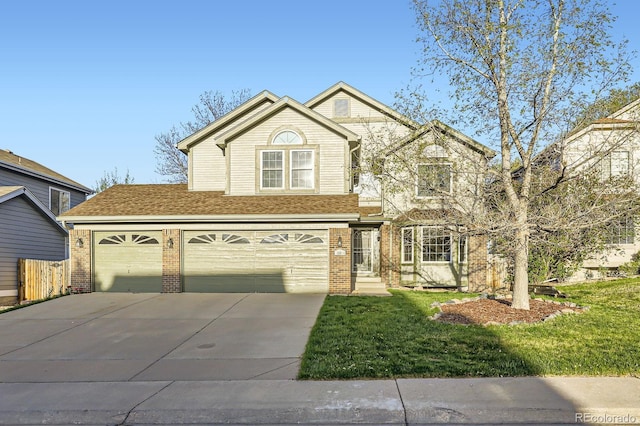 traditional-style house featuring a front lawn, brick siding, driveway, and an attached garage