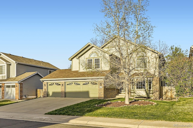 traditional-style house with brick siding, a garage, driveway, and a front yard