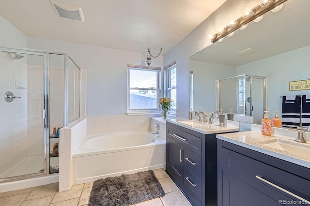 full bathroom with two vanities, a sink, visible vents, a shower stall, and a garden tub