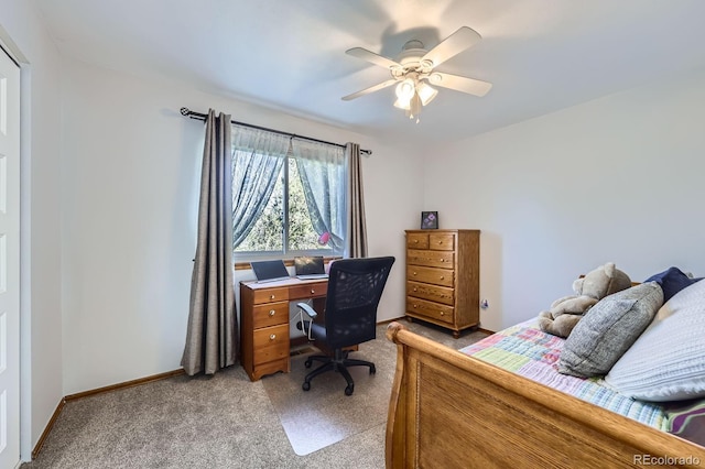 bedroom with light colored carpet, ceiling fan, and baseboards