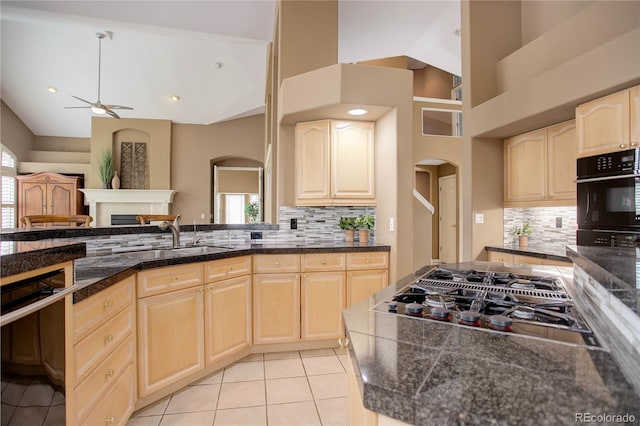 kitchen featuring a healthy amount of sunlight, sink, appliances with stainless steel finishes, and tasteful backsplash