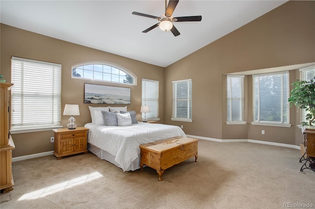 bedroom featuring vaulted ceiling, light carpet, and ceiling fan