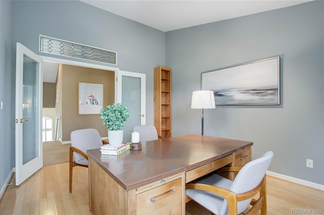 office featuring light wood-type flooring and french doors