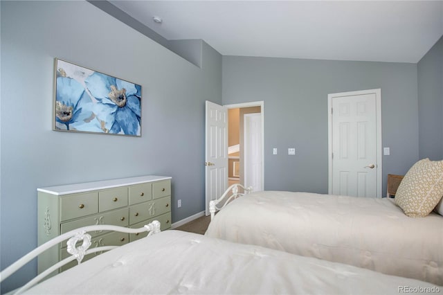 bedroom featuring vaulted ceiling