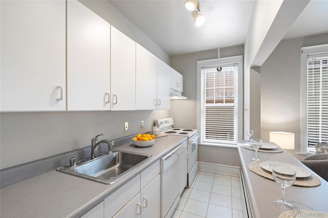 kitchen featuring white cabinets, white appliances, light tile patterned floors, and sink