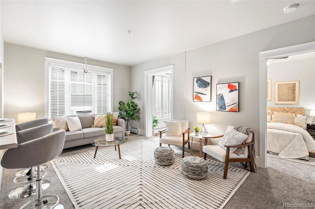 living room featuring baseboard heating and carpet