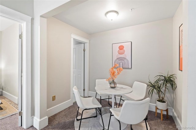 view of carpeted dining space